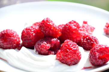 Raspberry. Sweet red raspberries. Juicy raspberries on the table. Fresh Raspberries. Rubus idaeus. Sweet healthy dessert. Fruit dessert.