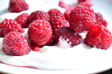 Raspberry. Sweet red raspberries. Juicy raspberries on the table. Fresh Raspberries. Rubus idaeus. Sweet healthy dessert. Fruit dessert.