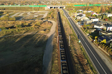 Aerial view coal train alongside paved road