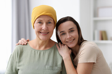Woman with cancer and her daughter at home