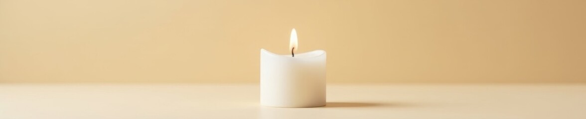 Solitary white wax candle flame on beige, textured background , glow, light