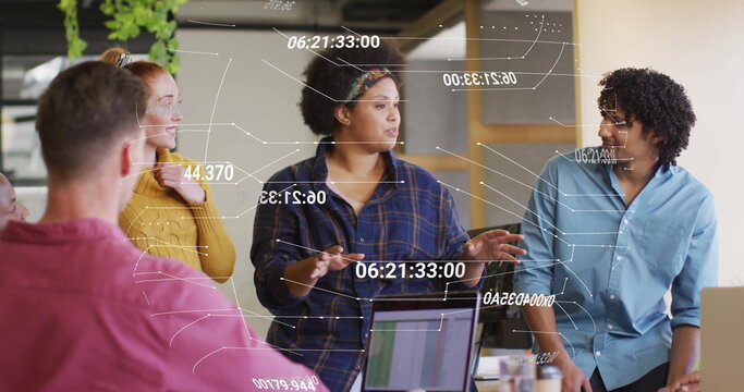 Image of data processing over diverse colleagues having meeting in office