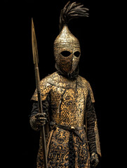Fototapeta premium Regal Warrior: Intricate details of a historical warrior, exuding strength and authority in a captivating portrait, showcasing the craftsmanship of battle attire.