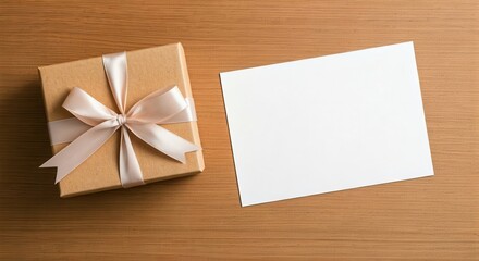 Elegant gift box with ribbon bow and blank card on wooden background for personalized message