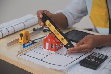 Image of engineer meeting for architectural project. working with partner and engineering tools on workplace vintage tone.