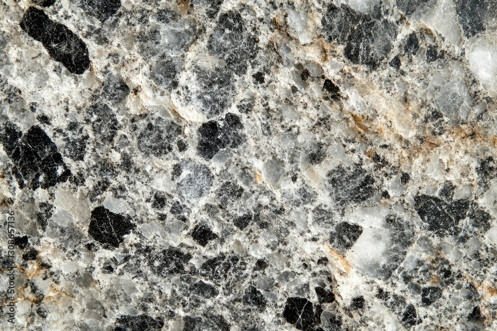 Aufkleber close-up view of a gray and black marble stone texture with white veining and speckled patterns.