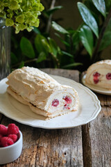 meringue roll with raspberry and almond petals