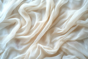 Obraz premium Cream-colored sheer fabric with soft, flowing folds and wrinkles, creating a luxurious and elegant texture.
