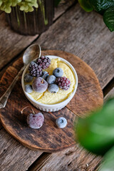 cottage cheese soufflé with berries. wooden background.