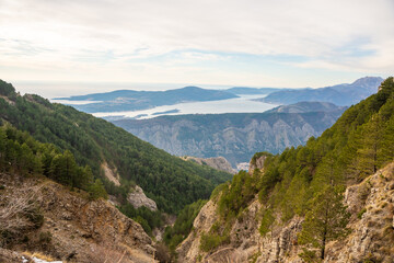 Fototapeta premium Panoramic view of Kotor Bay Boca and mountains from mountain view point in Montenegro in winter time