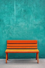 Orange bench against teal wall (1)