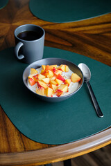 Cottage cheese with cream, peaches. Side view.