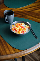 Cottage cheese with cream, peaches. Side view.