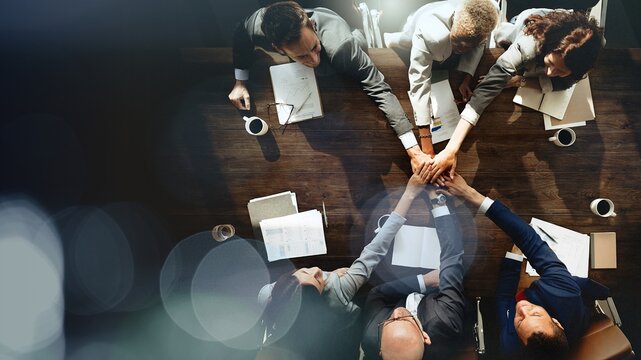 Business people are joining hands together