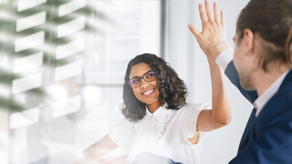 Business people giving a high five