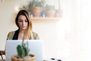 Relaxed woman working from home on her laptop