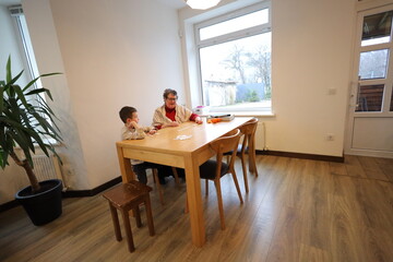 Grandmother and a grandson playing