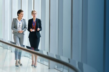 Two businesswomen working together in an office building