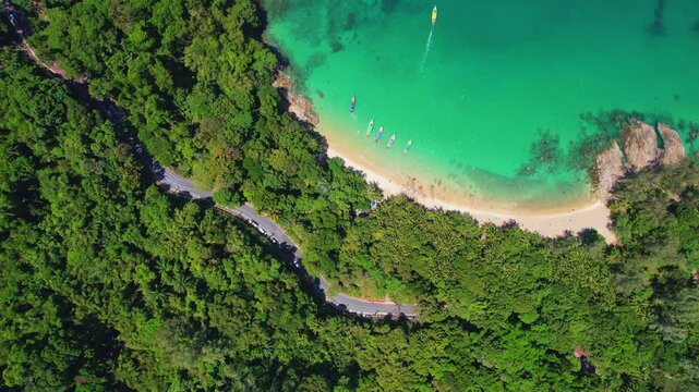 Aerial view turquoise water, tropical beach Phuket with longtail boat, Travel video Thailand.