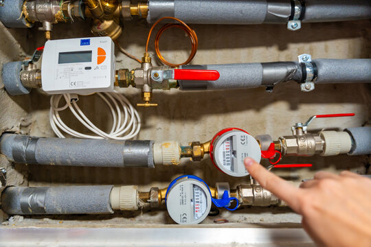 Smart water and heat meters with remote data transmission installed in a European utility system. The concept represents modern energy efficiency and digital infrastructure development