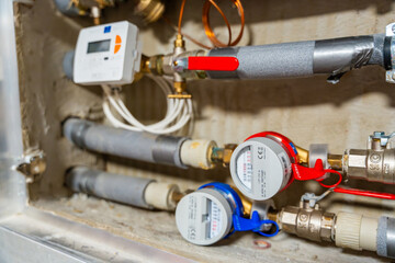 Smart water and heat meters with remote data transmission installed in a European utility system. The concept represents modern energy efficiency and digital infrastructure development