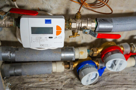 Smart water and heat meters with remote data transmission installed in a European utility system. The concept represents modern energy efficiency and digital infrastructure development