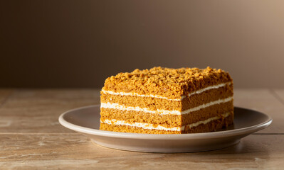 Traditional homemade honey cake on a beige background.