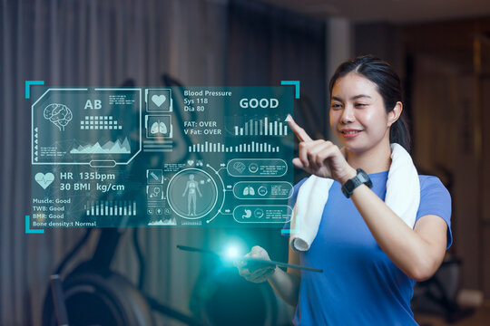 sport women using AI computer technology to analysis body information display graphic summery effect - Powered by Adobe
