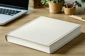 White closed book mockup on scandinavian style office desk. Minimalistic mockup for design and printing