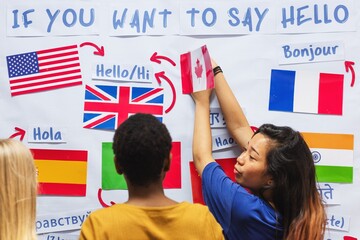 Diverse group learning languages. Multicultural students explore greetings. Flags and languages. Language learning and cultural exchange. Diverse group, languages, flags. Education and knowledge. © Rawpixel.com