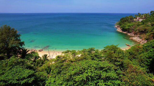 Aerial view turquoise water, tropical beach Phuket with longtail boat, Travel video Thailand.