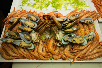 Seafood. Set of different seafood, shrimp, prawns, mussels, spider crab, lobster to serve in a catering. Celebration and event concept.