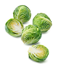 Brussels sprouts cut in half isolated on white background. Vertical layout.