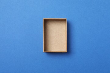 Open cardboard box on blue background