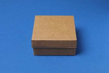 Cardboard box on blue background