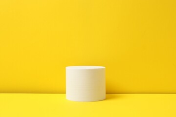 White podium on a yellow background