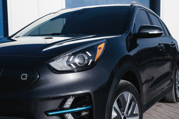 A stylish and modern electric car.  fast charging port. Exterior details.