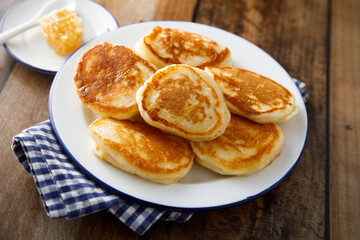Homemade fluffy pancakes with honey