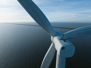 Offshore wind turbines, close up view, winds and generate vast amounts of energy. Afsluitdijk, The Netherlands.