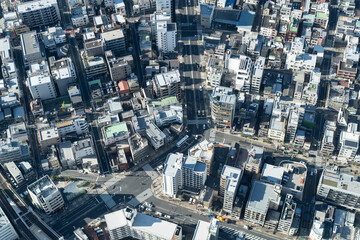 Fototapeta premium Aerial view of modern urban architecture and streets, Bird's-eye view of city streets in Tokyo, Japan