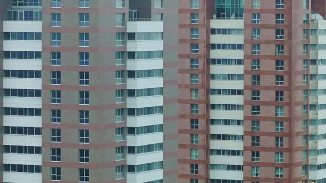 Close-up view of modern high-rise residential buildings, repeating glass facades