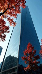 Intertwined branches reflected on sleek glass tower, graphic, background