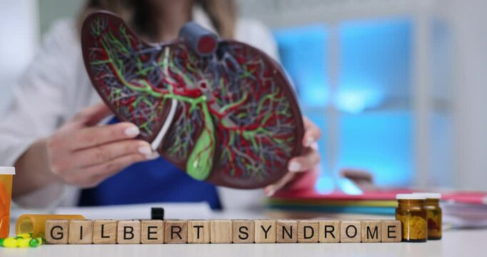 A knowledgeable healthcare professional thoroughly explains Gilbert Syndrome using comprehensive educational materials