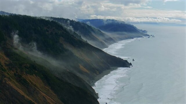 USAL Beach Sinkyone Wilderness Northern California aerial drone rugged untouched coastline mist rain evaporating morning remote untouched black sand waves crashing bluffs Lost Coast Trail static shot
