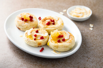 Homemade curd cakes with honey and coconut