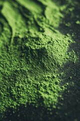 Moringa powder showcasing vibrant green color on dark surface