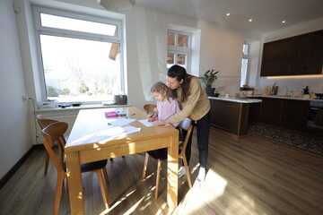 Mother and a daughter indoors spending time together