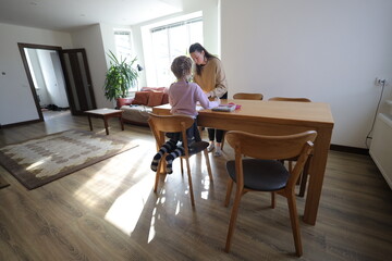 Mother and a daughter indoors spending time together