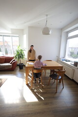 Mother and a daughter indoors spending time together