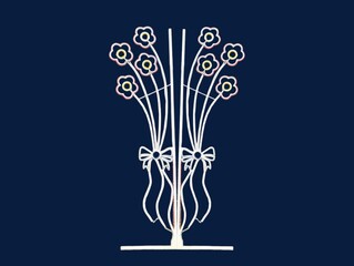 The dark blue background in the picture is a white wrought iron flower frame with a white bow tied to it and the stand is made of white iron used to decorate the garden for the beauty of the arrangeme